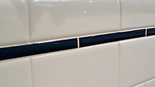 Grout between ceramic wall tiles